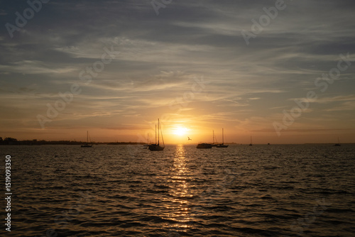 Sailboat silhouette at sunrise Palma Sola Bay, Bradenton