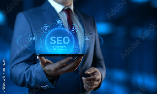 Businessman holding smartphone with Search Engine Optimization SEO icons on screen - Digital Marketing Concept