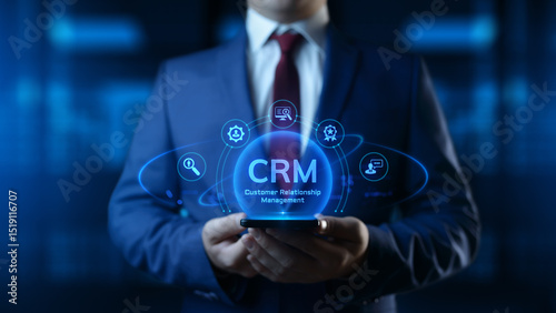Businessman holding smartphone with CRM Customer Relationship Management icons on screen