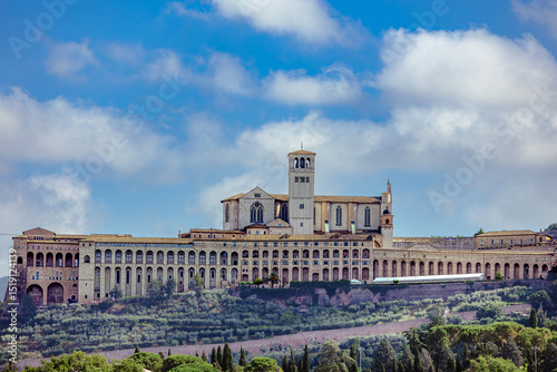 Papal Basilica of Saint Francis of Assisi showcasing stunning architecture under a clear blue sky in Umbria. Assisi, Umbria, Italy