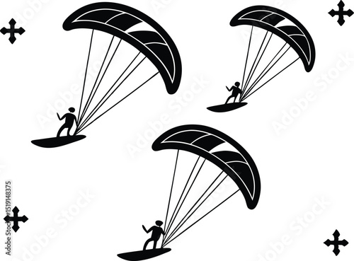 Three paragliders soaring in the sky with cross symbols