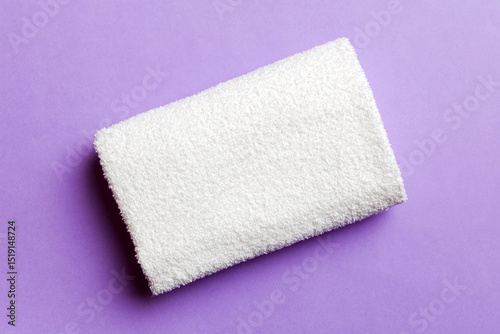 Top view of white towels with copy space on colored background