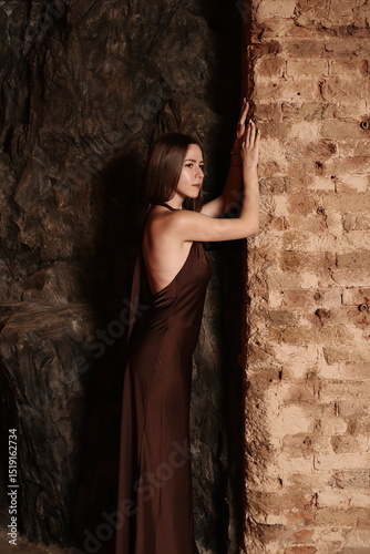 Ethereal and Artistic Pose in a Mysterious Dark Cave Captivating Fashion Photography