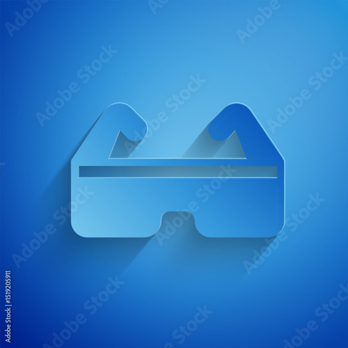 Paper cut Safety goggle glasses icon isolated on blue background. Paper art style. Vector