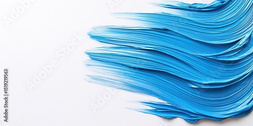 Different brushes with paints on a white background