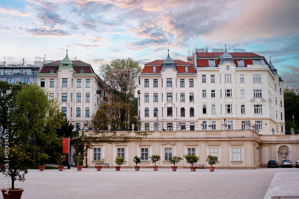 Fototapeta premium European Urban Architecture Featuring Historical Buildings and Courtyard at Sunset