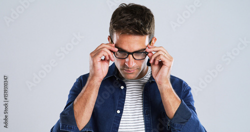 Photos Man, glasses and touch in studio for vision, optometry or adjusting to new lens for sight