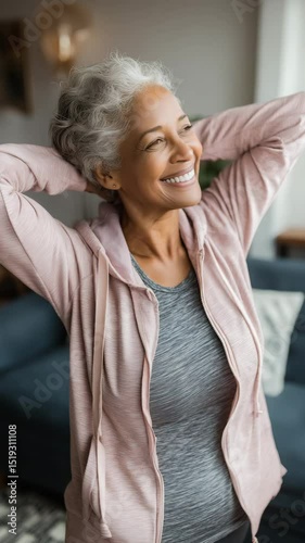 Wallpaper Mural Happy senior woman stretching and smiling indoors
 Torontodigital.ca