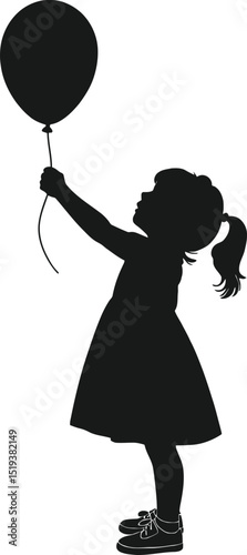Silhouette of a little girl holding a balloon up high