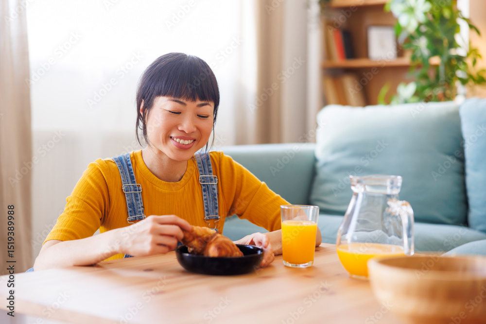 Woman having breakfast at home Woman having breakfast at home