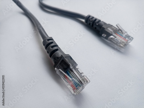 A coil of an Internet network cable for data transmission on a white background. Patch cord for LAN cable.