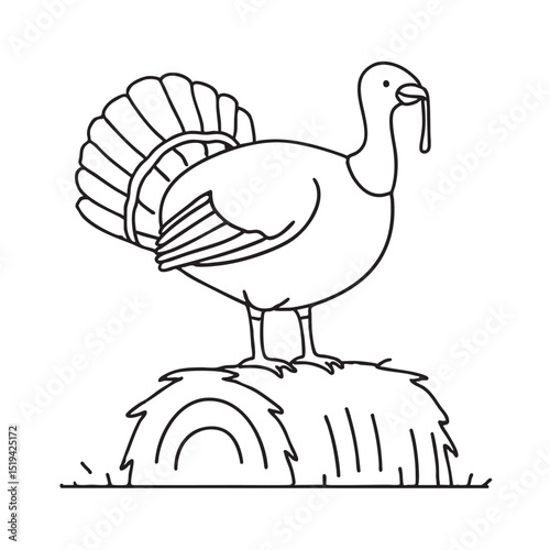 A turkey resting atop a hay bale