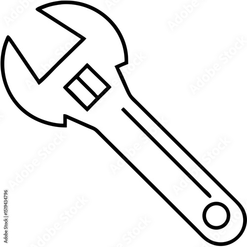 Adjustable wrench lying on a workbench with scattered tools during a repair session in a garage