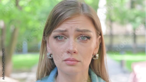 Close-up of a Crying Young Woman Face