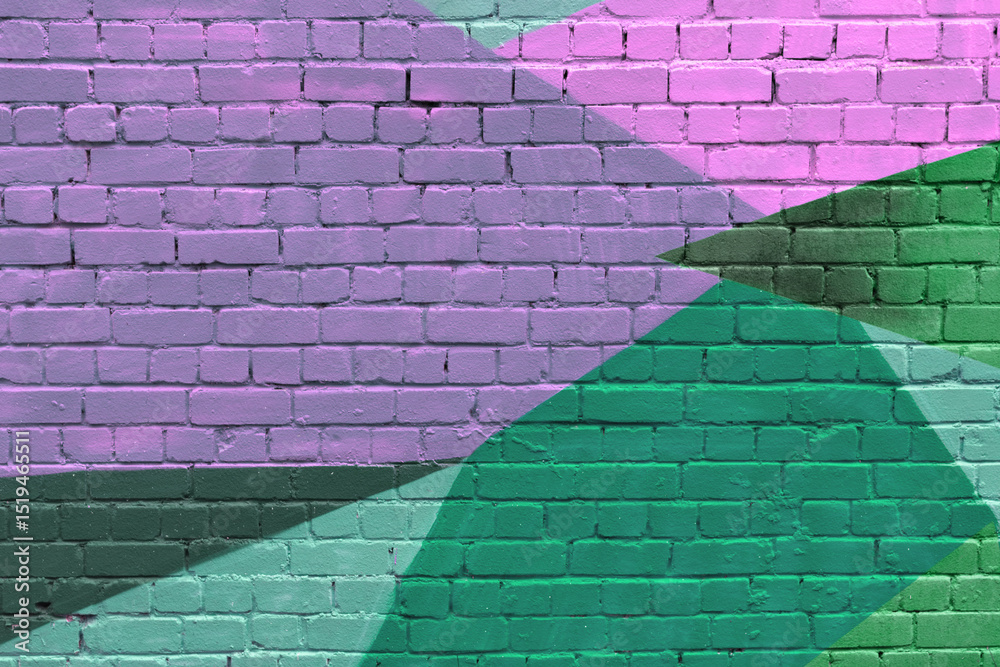 Fototapeta premium Abstract geometric mural with overlapping shapes in pink, green, and purple covers brick wall, creating bold urban background for creative projects.
