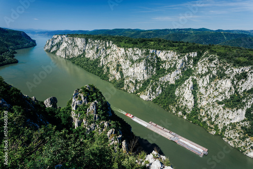 Barge navigating the danube river through the scenic cazane gorges