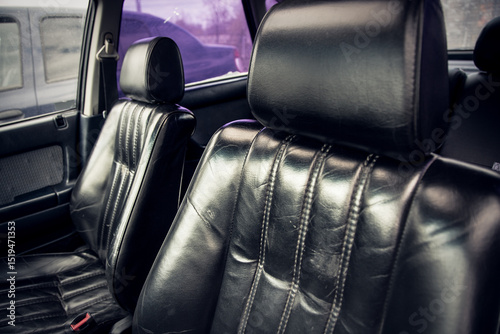 Shiny Black Leather Armchairs Inside Vintage Car – Classic Automotive Interior Design