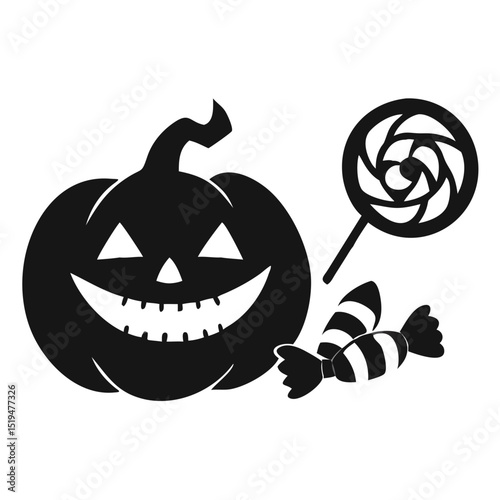 Halloween decorations featuring a spooky pumpkin with a lollipop and candy on display for festive celebrations