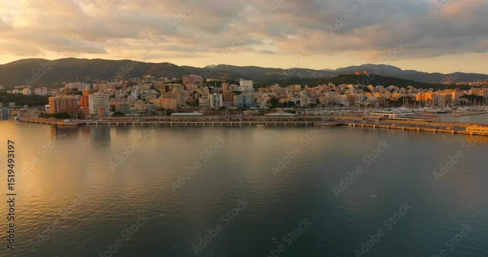 As the sun sets over Palma de Mallorca, stunning colors reflect on the water. The skyline glows with life while the mountains provide a serene backdrop, embodying the beauty of this Spanish island. As the sun sets over Palma de Mallorca, stunning colors reflect on the water. The skyline glows with life while the mountains provide a serene backdrop, embodying the beauty of this Spanish island.