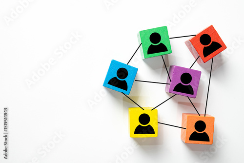 Colorful wooden blocks with person icons linked together in a network. Symbolizes teamwork, business collaboration, organizational structure, communication, human resources,social networking.