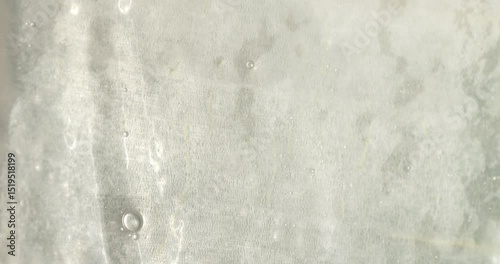 Close-up of the aloe vera leaf pulp. Drops of aloe juice trickle down the gel-like surface. Extract from leaves of aloe vera. Gel serum of aloe vera.