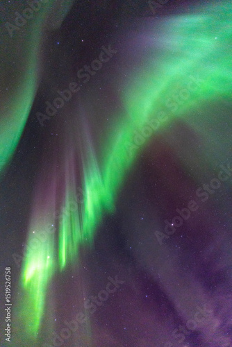 Equinox Aurora and Northern light on the sky, heavenly aurora borealis in green, purple and red over our head! amazing and beautiful, incredible strong dancing lady aurora like a phenix, rays of light