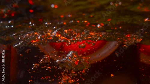 imitation of the sea in the lava of a volcano, the texture of the water rumbles chaos with bubbles created by the air that comes out in the red light