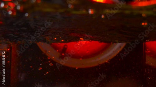 imitation of the sea in the lava of a volcano, the texture of the water rumbles chaos with bubbles created by the air that comes out in the red light