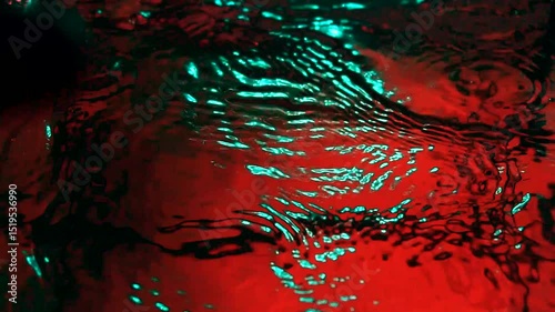 imitation of the sea in the lava of a volcano, the texture of the water rumbles chaos with bubbles created by the air that comes out in the red light