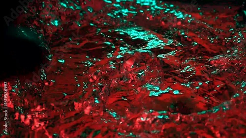 imitation of the sea in the lava of a volcano, the texture of the water rumbles chaos with bubbles created by the air that comes out in the red light