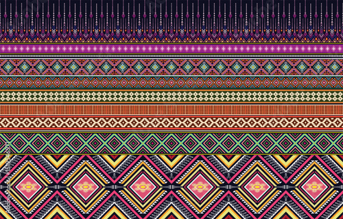 Geometric ethnic pattern oriental design on dark midnight navy background. Traditional geometry abstract with pink, white, yellow, green color for wallpaper handcraft, carpet, clothing, fabric design.