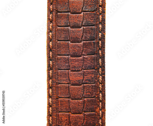 A piece of genuine leather embossed belt isolated on white photo