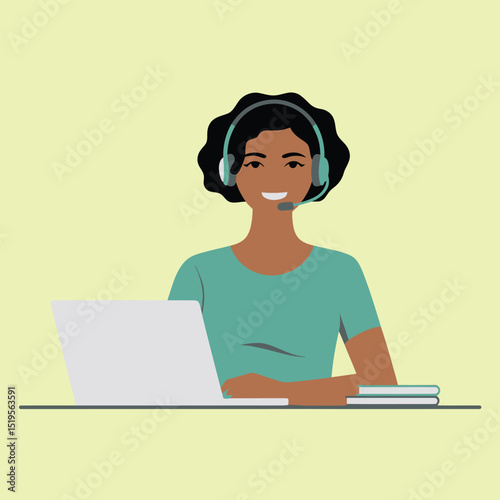 Smiling black woman with headset working on laptop at desk represents customer service support or remote office assistance