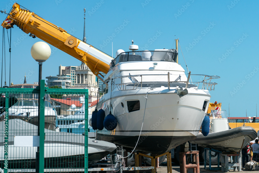 Naklejka premium White boat in the parking lot of the resort town port.