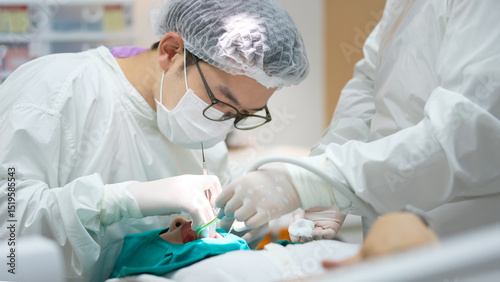 Dentist and assistant work closely together during an oral surgery procedure, emphasizing precision and hygiene in a clinical setting.