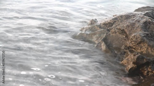 Sea water hitting the rocks.