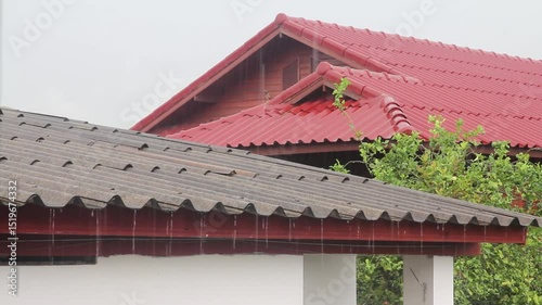 Light rain on the tiled roof.