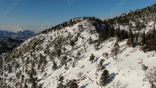 A panoramic aerial view of snow-covered mountains in winter. Gidengelmez Mountain, Akseki, Antalya, Turkey.	
