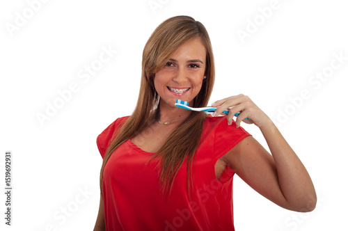young woman brushing her teeth