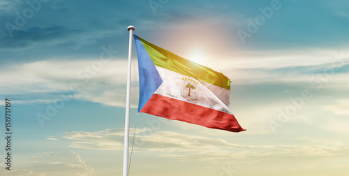 Equatorial Guinea national flag waving in beautiful sky with mast. A proud moment flag waving with sunlight. photo