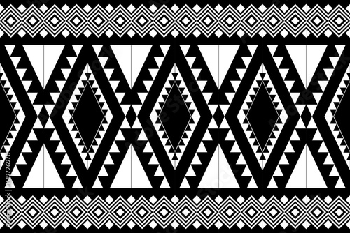 Black and white geometric tribal pattern in a native, African-inspired style. Symmetrical and abstract design suitable for backgrounds, textiles, decor, or graphic projects.
