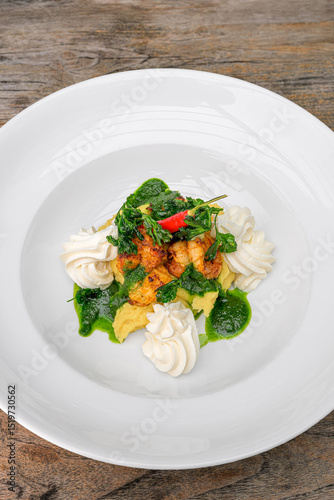 marinated chili prawns on creamy polenta (gluten-free) with ricotta and parsley pesto