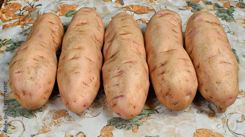 Raw Potatoes In A Row On Table