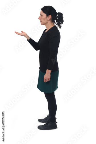 side view of a woman showing an imaginary object in her hand on white background
