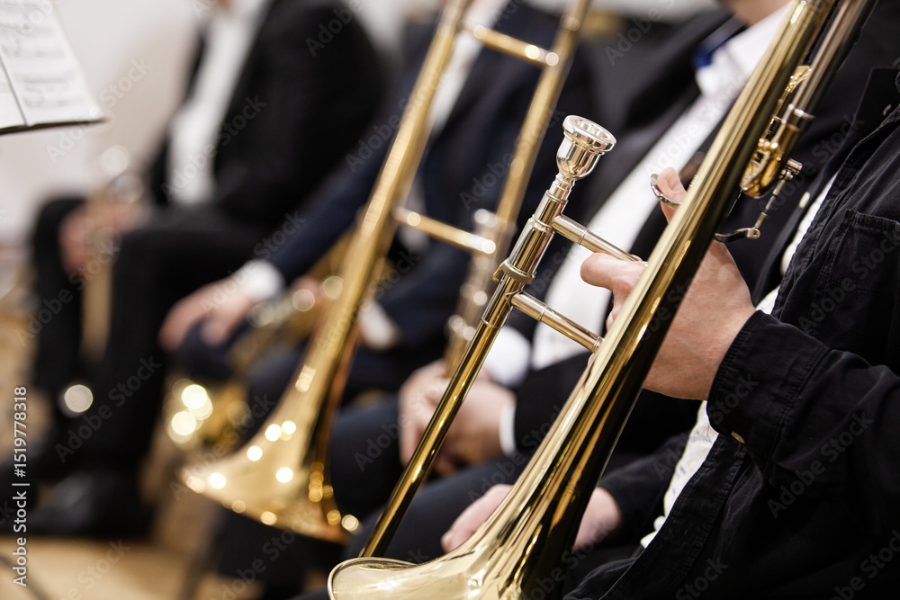 Obraz premium Trombones in the hands of musicians in an orchestra