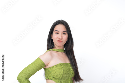 Fotografija Unimpressed Asian teen raises an eyebrow and purses lips in mock disbelief or judgment, expressing playful rejection