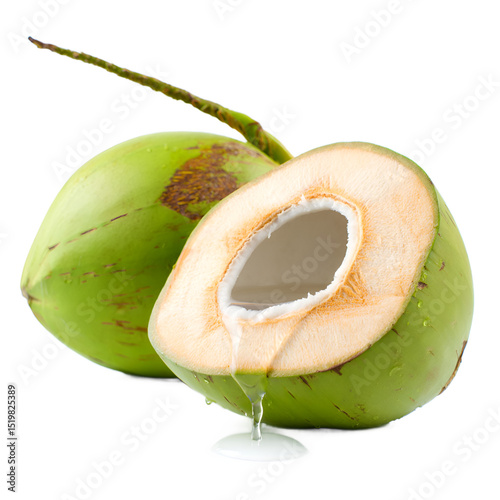 Fresh young green coconuts, one whole and one half, with clear coconut water pouring out, isolated on white.