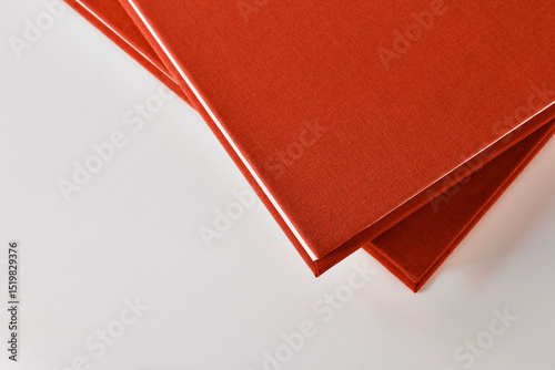 Two books on white table