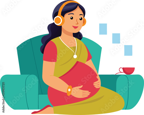 Pregnant woman listening music sitting on a turquoise sofa
