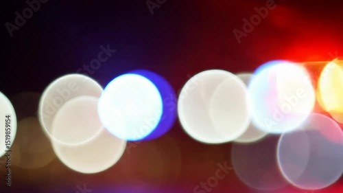 Dynamic police lights at night abstract blur with bokeh effect transition.